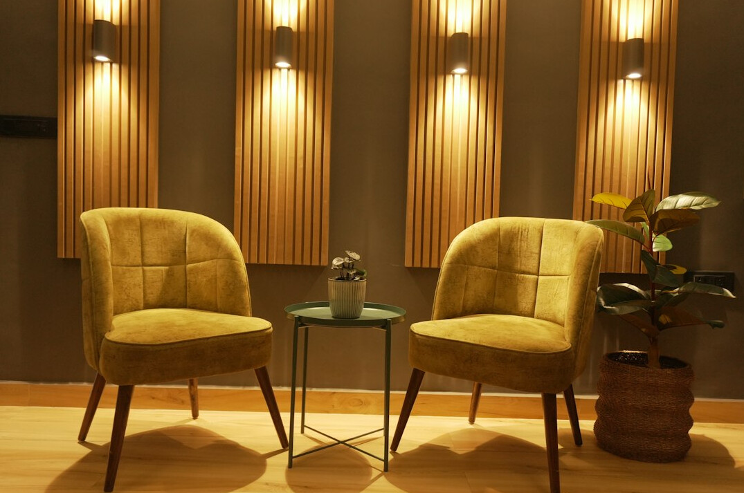 Television talk show studio set with two armchairs and warm lights