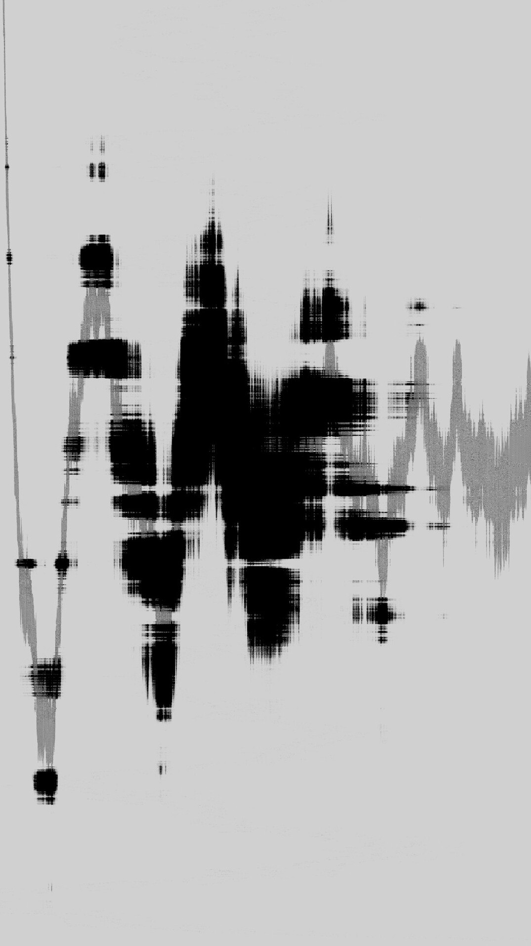 Audio waveform on a monitor next to professional headphones